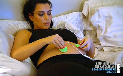 Kim Uses BellyBuds® to Give Baby North First Music Lesson